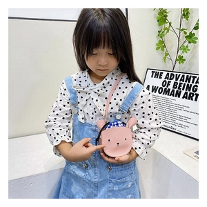 Toddler girl wearing pink cartoon bear crossbody bag with blue checkered drawstring detail