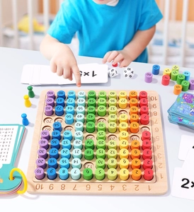 Detail of wooden multiplication board with colorful number blocks and educational cards