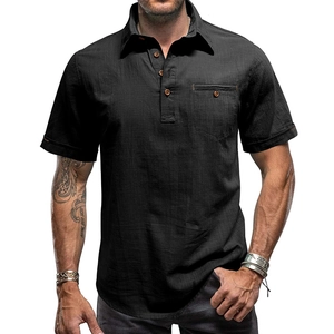 Detail of black cotton linen shirt featuring wooden buttons and chest pocket texture