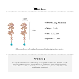 Detailed view of rhinestone butterfly tassel earrings with 7.2cm length and 2.2cm width