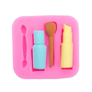 Pink silicone makeup mold with lipstick and brush shapes for fondant cake decorating