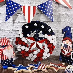 Detailed close-up of Independence Day decor including USA star signs and gnome dolls
