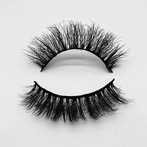 Detailed view of thick curly black faux mink eyelashes with natural texture and volume