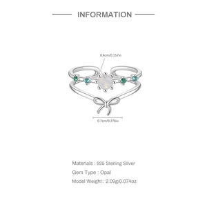 Macro detail of S925 sterling silver bow ring with opal and blue gemstones