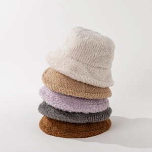 Stack of fuzzy solid color sherpa bucket hats for men and women in five stylish colors