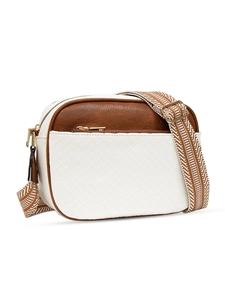 Detail of quilted crossbody bag featuring textured woven front pocket and jacquard strap
