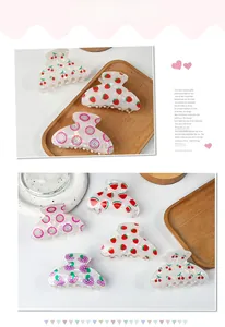 Detailed grid of five fruit-themed translucent acrylic hair claws on a stone display base