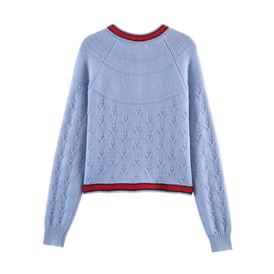 Light blue knit sweater with floral embroidery and contrasting striped neckline and hem