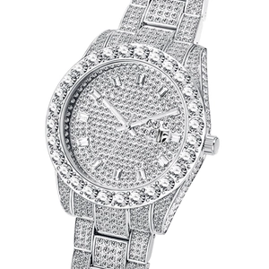Detailed close-up of a silver iced-out watch with full crystal pavé on dial and bezel