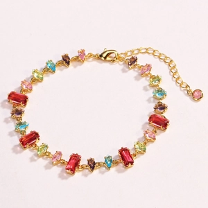 Detail of colorful gemstone bracelet with gold chain, lobster clasp and extender