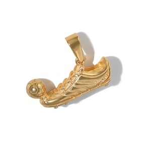 Detailed view of a golden stainless steel soccer cleat pendant kicking a football