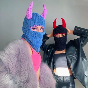 Detail of crochet balaclava with devil horns showing thick chenille knit texture
