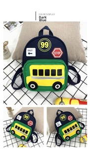 Detail view of mini toddler backpack with cartoon school bus embroidery and navy canvas texture