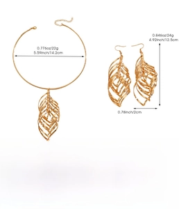 Detailed view of golden leaf swirl necklace and earring set with product dimensions