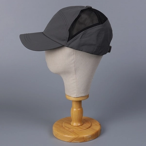 Detail of dark gray quick-dry mesh baseball cap with breathable side panels and strap buckle
