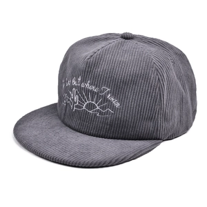 Close-up of cactus embroidery on grey corduroy flat brim cap with outdoor themed text