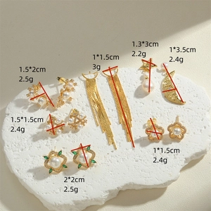 Golden earrings collection with freshwater pearls and star moon designs on white stone