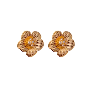 18k gold plated flower stud earrings with sparkling zircon centers on white background