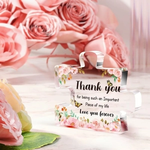 Macro detail of acrylic puzzle plaque with rose print and warm thank you message