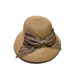 Summer khaki straw sun hat with large brown ribbon bow and elegant wide foldable brim