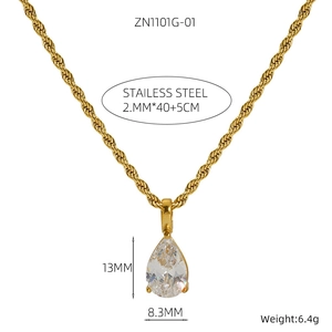 Detail of 18K gold plated stainless steel twist chain and teardrop crystal pendant necklace