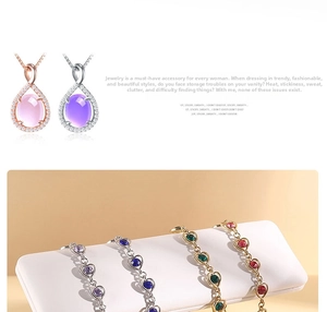 Detailed macro shot of heart-shaped multi-color gemstone links and teardrop pendants