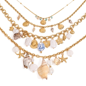 Layered gold titanium steel necklace featuring sea shells, starfish and pearls charms