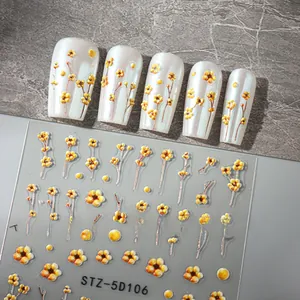 Detail of 5D embossed yellow daisy nail stickers with 3D texture and adhesive backing