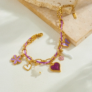 Elegant gold chain bracelet with purple glitter hearts, flowers and imitation pearls