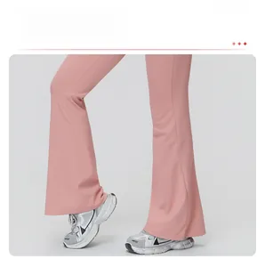 Close-up of pink flare leg yoga jumpsuit showing high-waist fit and brushed fabric texture