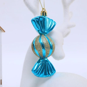 Blue candy-shaped Christmas tree ornament with golden glitter spirals and hanging string