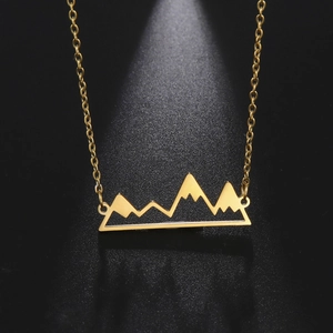 Minimalist gold stainless steel necklace with a hollow mountain peak pendant on black back
