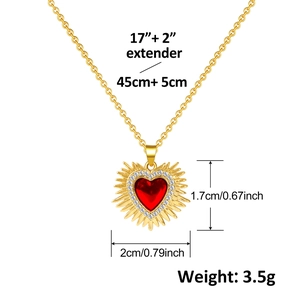 Detail view of heart-shaped ruby pendant with dimensions 2cm x 1.7cm and gold chain specs