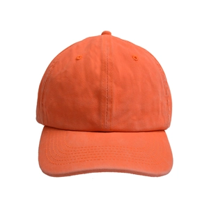 Detailed front view of a classic orange washed cotton baseball cap with a pre-curved brim