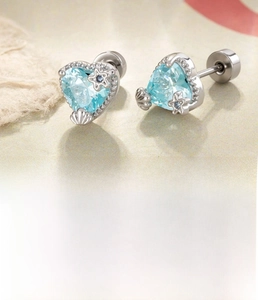 Macro shot of silver heart zircon earrings featuring screw flat back design and star detail