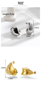 Detail view of chunky hollow teardrop earrings in gold and silver finishes with dimensions