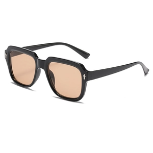 Retro square oversized sunglasses with black frames and light brown lenses at 45-degree angle