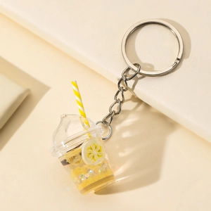 Luminous fruit milk tea cup keychain with yellow flower pattern and liquid glitter