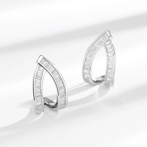 Luxury silver-plated geometric earrings with rectangular zircons on a white surface