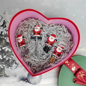 Detailed view of 4pcs Christmas Santa wine tools set in a red heart-shaped gift box