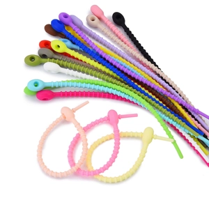 Macro view of flexible colorful silicone cable ties with non-slip ridges and locking holes