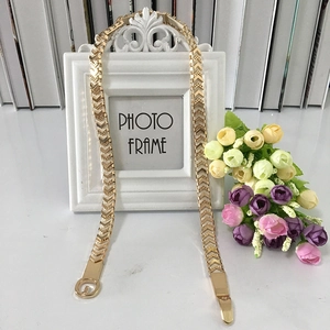 Elegant gold metal elastic belt with arrow pattern and round buckle for women