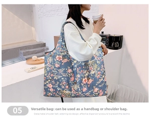Detail of a large floral waterproof tote bag shown on model in a cafe setting