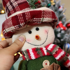 Plush Christmas snowman doll with red plaid hat and soft fabric texture for holiday gift