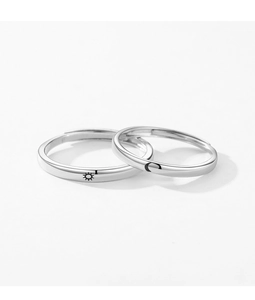 Detail of S925 sterling silver adjustable rings with sun and moon engraving for couples
