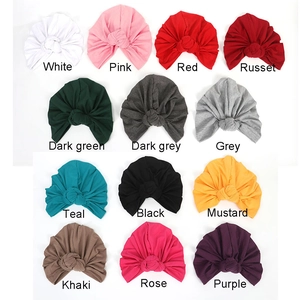 Multi-color stretchy turbans for women in various knit finishes on white background