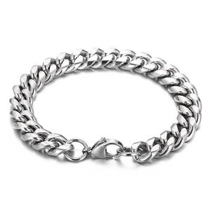 Polished silver stainless steel Cuban link bracelet with lobster clasp on grey background