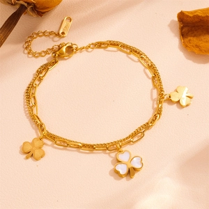 Detailed close-up of double-layer stainless steel clover bracelet with white inlay