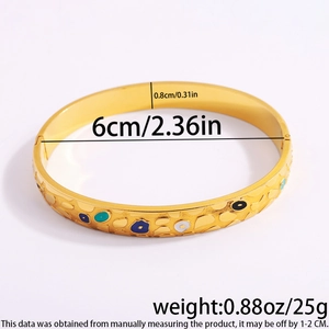 Detailed size view of gold-plated evil eye bangle with colorful enamel inlay patterns