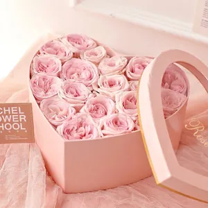 Pink heart-shaped flower gift box with roses and transparent window for Valentine's Day